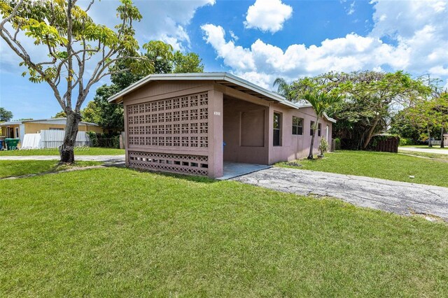4960 NW 11th Ct, Lauderhill, FL 33313 - view of side of home with stucco siding