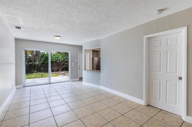 4960 NW 11th Ct, Lauderhill, FL 33313 - empty room featuring a smoke detector, a textured ceiling, light tile patterned floors, and baseboards