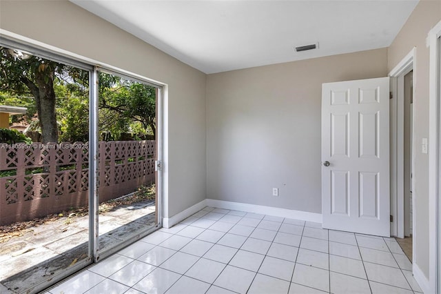 4960 NW 11th Ct, Lauderhill, FL 33313 - empty room with light tile patterned flooring and baseboards