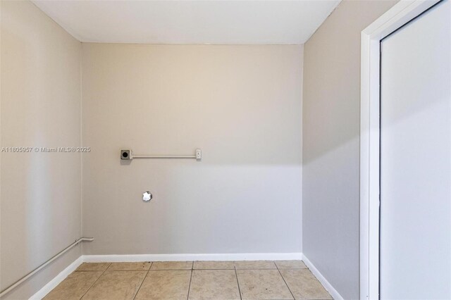 4960 NW 11th Ct, Lauderhill, FL 33313 - washroom with hookup for an electric dryer, light tile patterned floors, and baseboards
