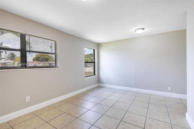 4960 NW 11th Ct, Lauderhill, FL 33313 - spare room with light tile patterned floors and baseboards