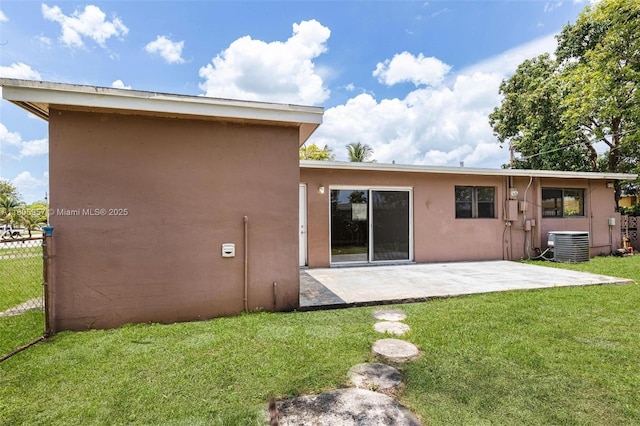 4960 NW 11th Ct, Lauderhill, FL 33313 - back of house featuring central AC unit, a patio area, and stucco siding