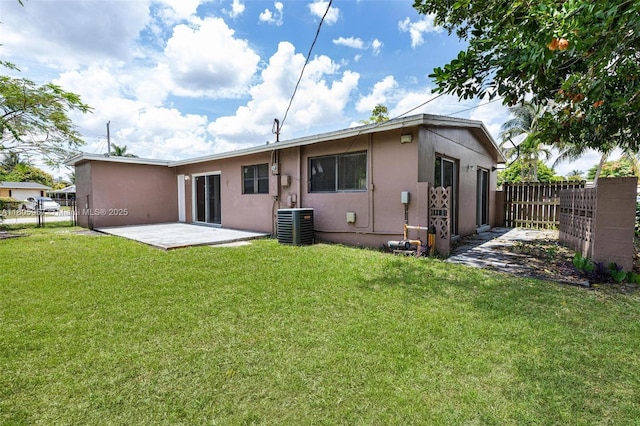 4960 NW 11th Ct, Lauderhill, FL 33313 - rear view of house featuring stucco siding, a patio, and cooling unit