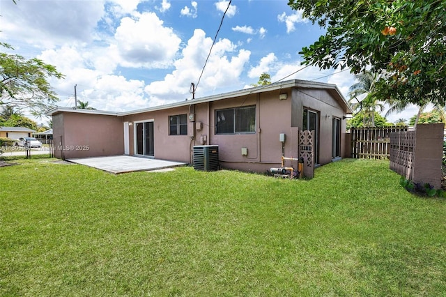 4960 NW 11th Ct, Lauderhill, FL 33313 - back of property featuring stucco siding, a patio area, and cooling unit
