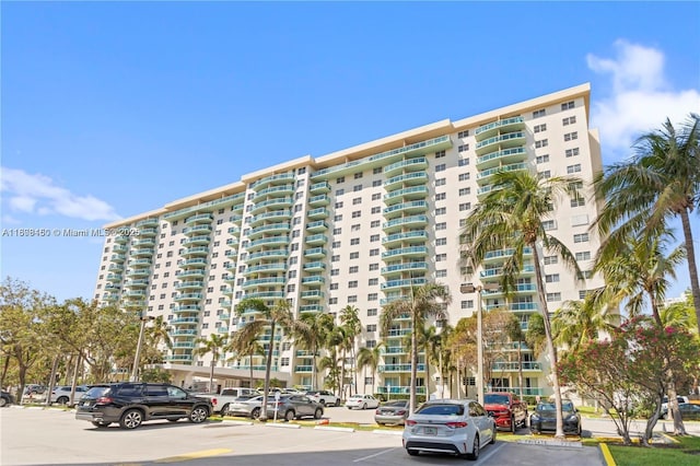 19390 Collins Ave Unit 217, Sunny Isles Beach, FL 33160 - view of apartment building / complex featuring uncovered parking