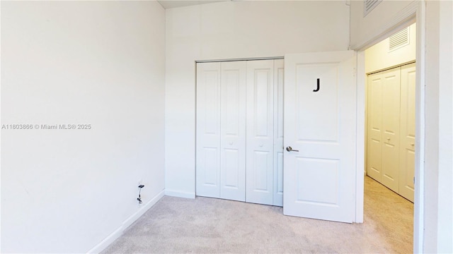 16233 SW 290th Ter, Homestead, FL 33033 - unfurnished bedroom with light carpet, a closet, and baseboards