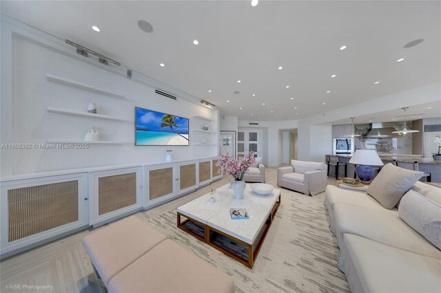 10225 Collins Ave Unit 604Renovated, Bal Harbour, FL 33154 - living area featuring built in shelves and recessed lighting