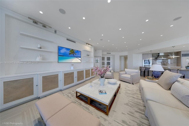 10225 Collins Ave Unit 604, Bal Harbour, FL 33154 - living room with built in shelves and recessed lighting