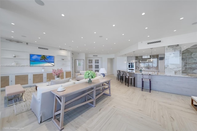 10225 Collins Ave Unit 604, Bal Harbour, FL 33154 - living room featuring recessed lighting and built in shelves