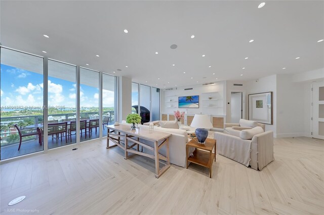 10225 Collins Ave Unit 604, Bal Harbour, FL 33154 - living area with built in features, expansive windows, and recessed lighting