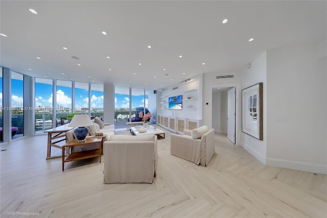10225 Collins Ave Unit 604, Bal Harbour, FL 33154 - living room featuring a wall of windows, recessed lighting, and baseboards