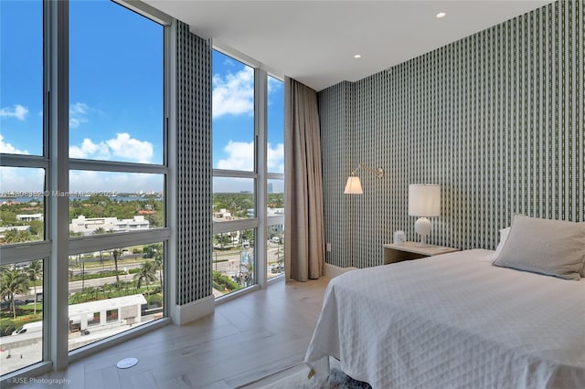 10225 Collins Ave Unit 604, Bal Harbour, FL 33154 - bedroom with floor to ceiling windows and wallpapered walls