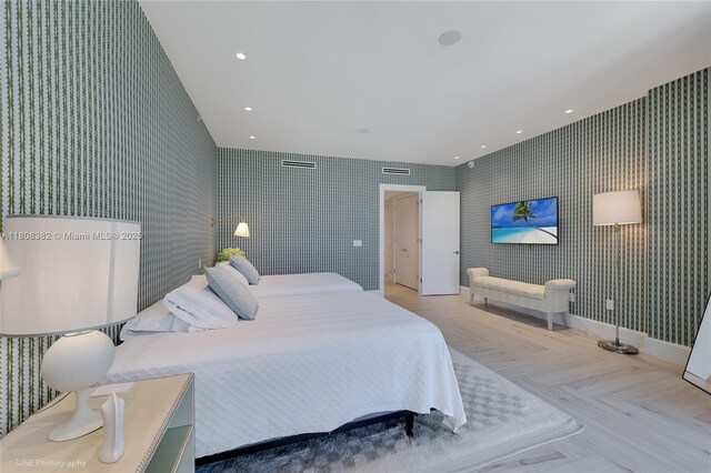10225 Collins Ave Unit 604Renovated, Bal Harbour, FL 33154 - bedroom featuring wallpapered walls, an accent wall, and recessed lighting