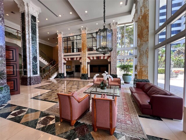 10225 Collins Ave Unit 604Renovated, Bal Harbour, FL 33154 - community lobby with a high ceiling, ornamental molding, stairway, and recessed lighting
