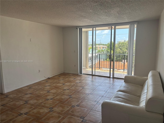 7850 Byron Ave Unit 403, Miami Beach, FL 33141 - living room with a wall of windows and a textured ceiling
