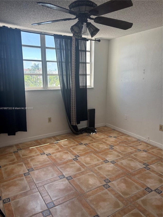 7850 Byron Ave Unit 403, Miami Beach, FL 33141 - empty room with ceiling fan and a textured ceiling