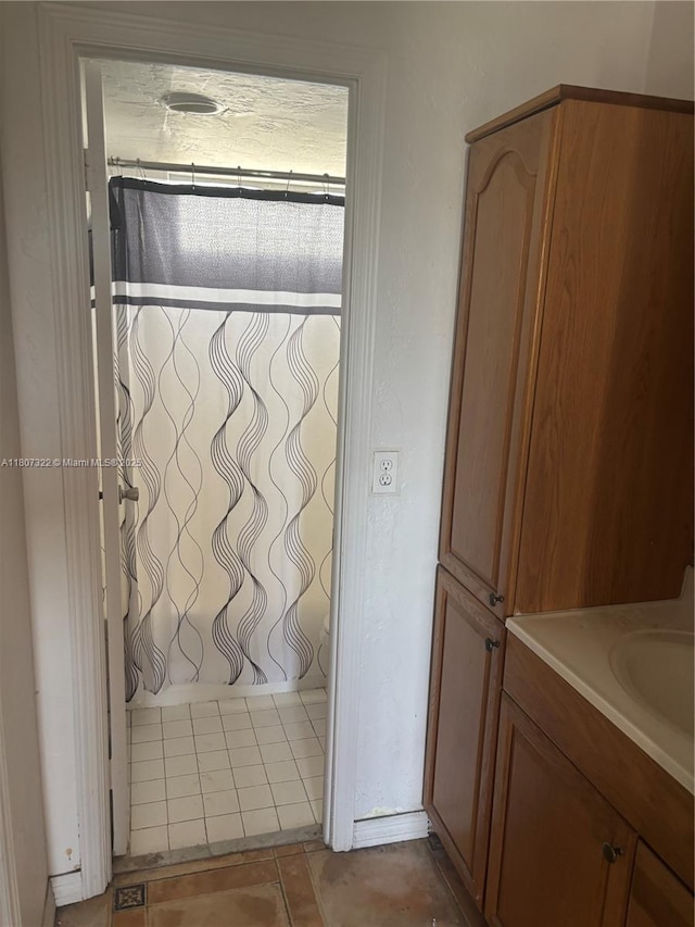 7850 Byron Ave Unit 403, Miami Beach, FL 33141 - full bath with vanity and tile patterned flooring