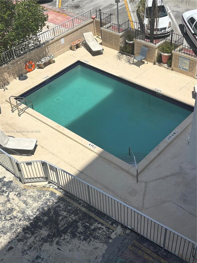 7850 Byron Ave Unit 403, Miami Beach, FL 33141 - community pool with a patio area