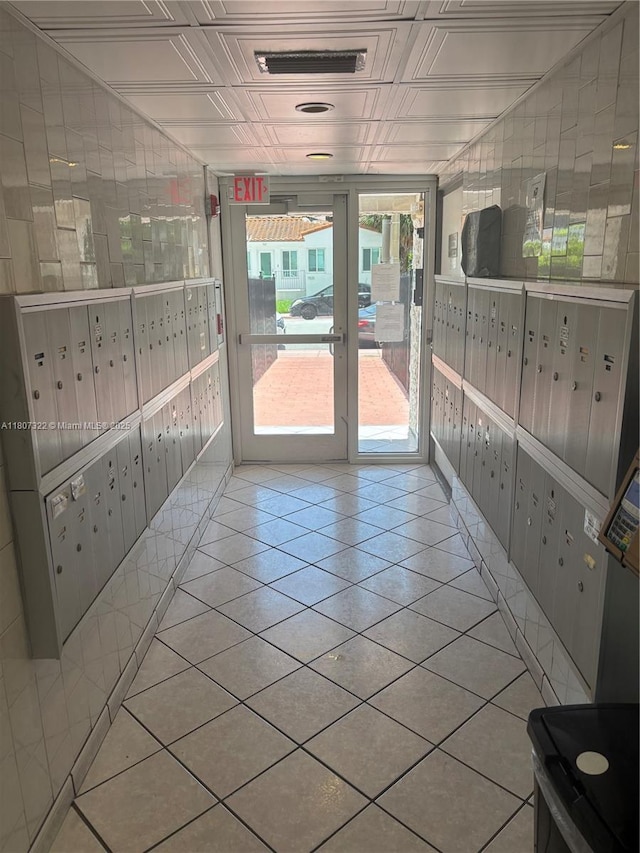 7850 Byron Ave Unit 403, Miami Beach, FL 33141 - tiled empty room featuring mail area and an ornate ceiling