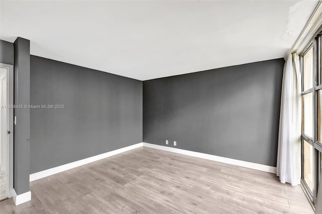16919 N Bay Rd Unit 521, Sunny Isles Beach, FL 33160 - spare room with light wood finished floors and baseboards