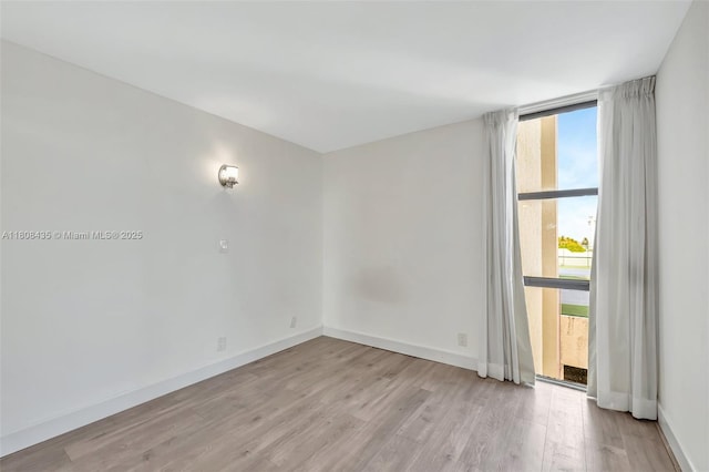 16919 N Bay Rd Unit 521, Sunny Isles Beach, FL 33160 - unfurnished room with light wood-style flooring and baseboards