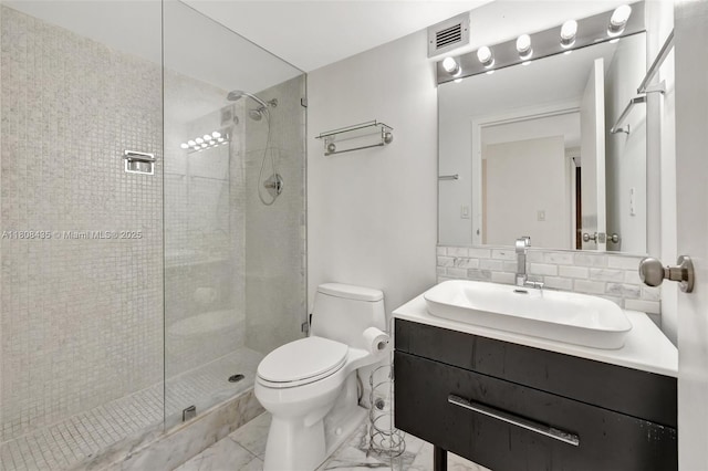 16919 N Bay Rd Unit 521, Sunny Isles Beach, FL 33160 - full bath with toilet, tiled shower, marble finish flooring, vanity, and tasteful backsplash