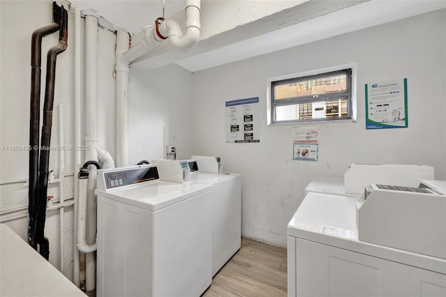 16919 N Bay Rd Unit 521, Sunny Isles Beach, FL 33160 - shared laundry featuring washer and dryer and light wood-style floors