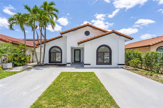 14234 SW 49th St, Miami, FL 33175 - mediterranean / spanish-style house featuring a tiled roof, stucco siding, and driveway