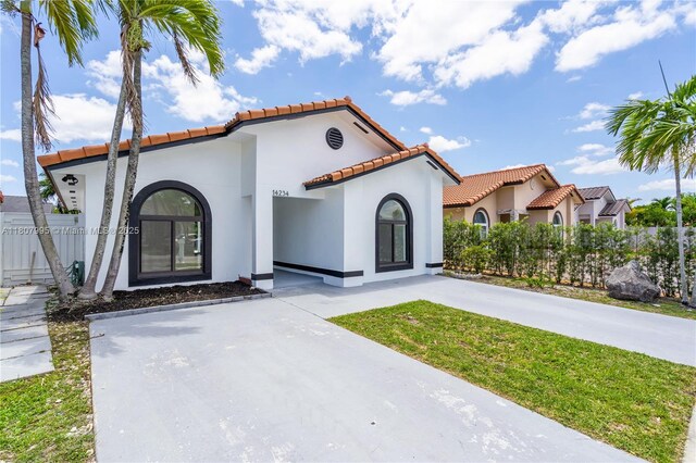 14234 SW 49th St, Miami, FL 33175 - mediterranean / spanish-style home featuring a tile roof and stucco siding