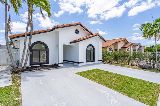 14234 SW 49th St, Miami, FL 33175 - mediterranean / spanish-style home featuring a tiled roof and stucco siding