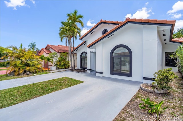 14234 SW 49th St, Miami, FL 33175 - mediterranean / spanish house with a tiled roof, stucco siding, and concrete driveway