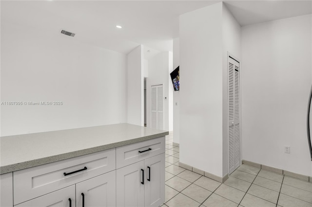 14234 SW 49th St, Miami, FL 33175 - hallway with light tile patterned floors, recessed lighting, and baseboards
