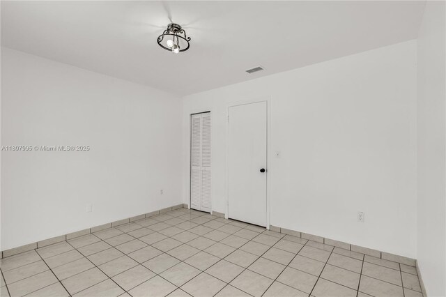 14234 SW 49th St, Miami, FL 33175 - spare room featuring baseboards and light tile patterned floors