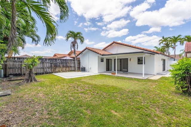 14234 SW 49th St, Miami, FL 33175 - rear view of property with a patio area, a tiled roof, stucco siding, and central AC unit