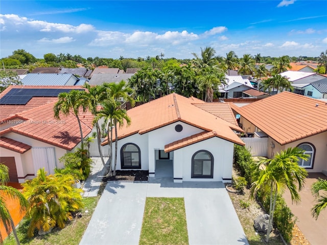 14234 SW 49th St, Miami, FL 33175 - view of front of home with driveway, a residential view, stucco siding, and a tile roof