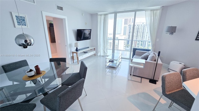 480 NE 30th St Unit 1405, Miami, FL 33137 - living room featuring a wall of windows and light tile patterned floors