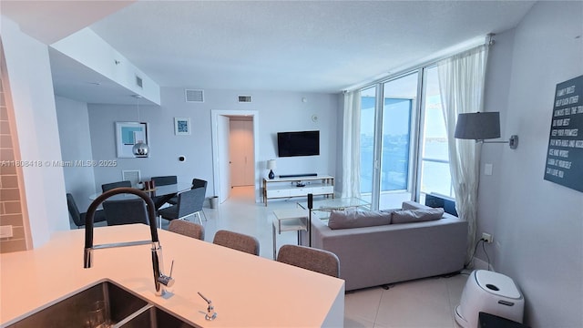 480 NE 30th St Unit 1405, Miami, FL 33137 - living room featuring expansive windows and light tile patterned floors