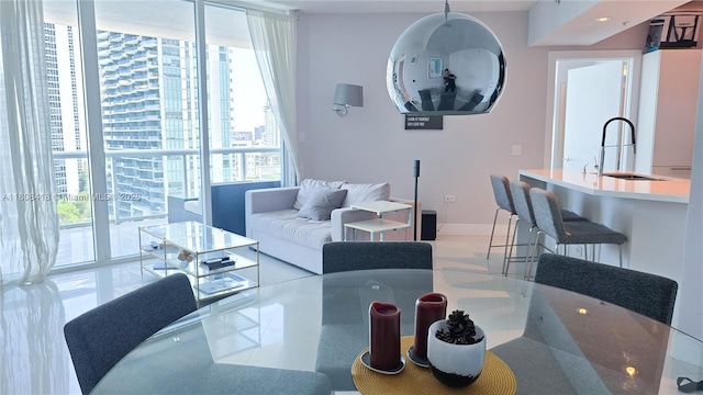 480 NE 30th St Unit 1405, Miami, FL 33137 - dining area with a wall of windows and baseboards