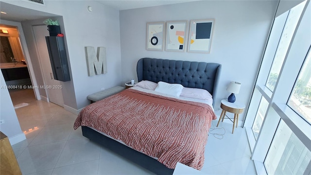 480 NE 30th St Unit 1405, Miami, FL 33137 - bedroom with tile patterned flooring and baseboards