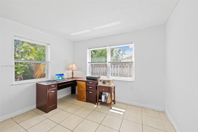 1625 NE 29th St, Pompano Beach, FL 33064 - home office featuring plenty of natural light, light tile patterned flooring, and baseboards
