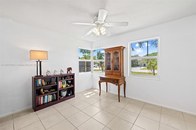1625 NE 29th St, Pompano Beach, FL 33064 - sitting room with healthy amount of natural light, a ceiling fan, baseboards, and light tile patterned floors