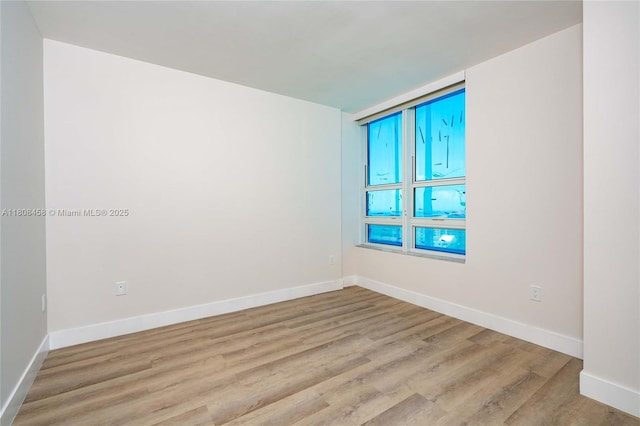 950 Brickell Bay Dr Unit 4007, Miami, FL 33131 - empty room with wood finished floors and baseboards