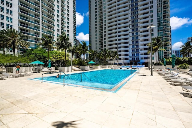 950 Brickell Bay Dr Unit 4007, Miami, FL 33131 - community pool featuring a patio