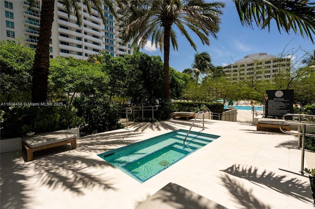 950 Brickell Bay Dr Unit 4007, Miami, FL 33131 - community pool featuring a patio