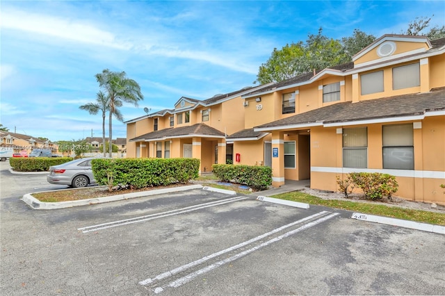 2288 SW 81st Ave Unit 2288, Miramar, FL 33025 - view of building exterior with uncovered parking and a residential view