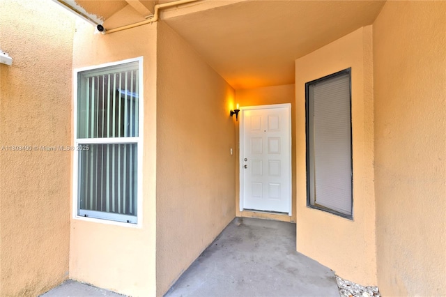 2288 SW 81st Ave Unit 2288, Miramar, FL 33025 - doorway to property featuring stucco siding and a surveillance system