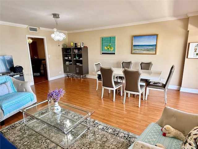 1800 NE 114th St Unit 1607, Miami, FL 33181 - living room with a chandelier, ornamental molding, wood finished floors, and baseboards