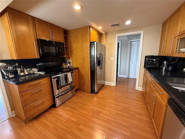 1800 NE 114th St Unit 1607, Miami, FL 33181 - kitchen featuring stainless steel appliances, light wood-type flooring, brown cabinetry, a sink, and recessed lighting