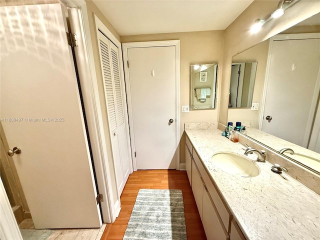 1800 NE 114th St Unit 1607, Miami, FL 33181 - bathroom with a closet, vanity, and wood finished floors