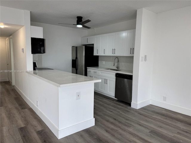 630 Layne Blvd Unit 211, Hallandale Beach, FL 33009 - kitchen featuring appliances with stainless steel finishes, dark wood-style floors, light countertops, and white cabinets